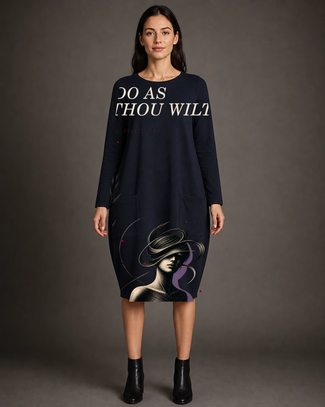 Woman wearing the midnight Scarlett 93 dress with Do As Thou Wilt typography and abstract orbital portrait